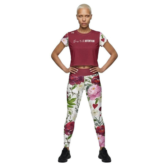Model Wearing Jesus Loves You Crop Top with Dress With Intention on Front in Red with matching workout leggings and floral design, front view