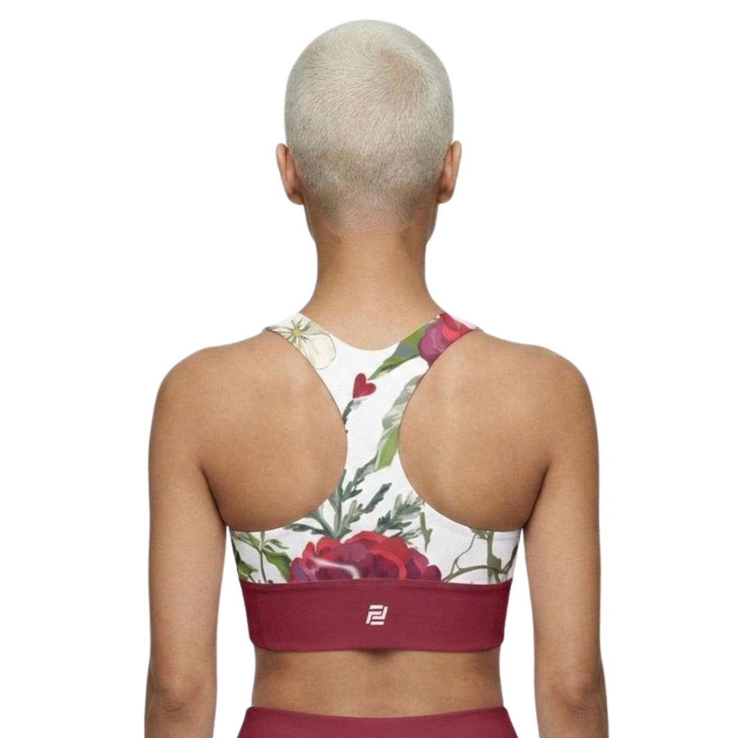 Model shown from the back wearing Roses of Grace sports bra with a floral pattern and red band
