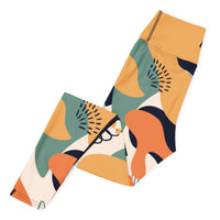 Fierce & fluid abstract yoga leggings with vibrant colors, eco-friendly women’s activewear left folded viewn