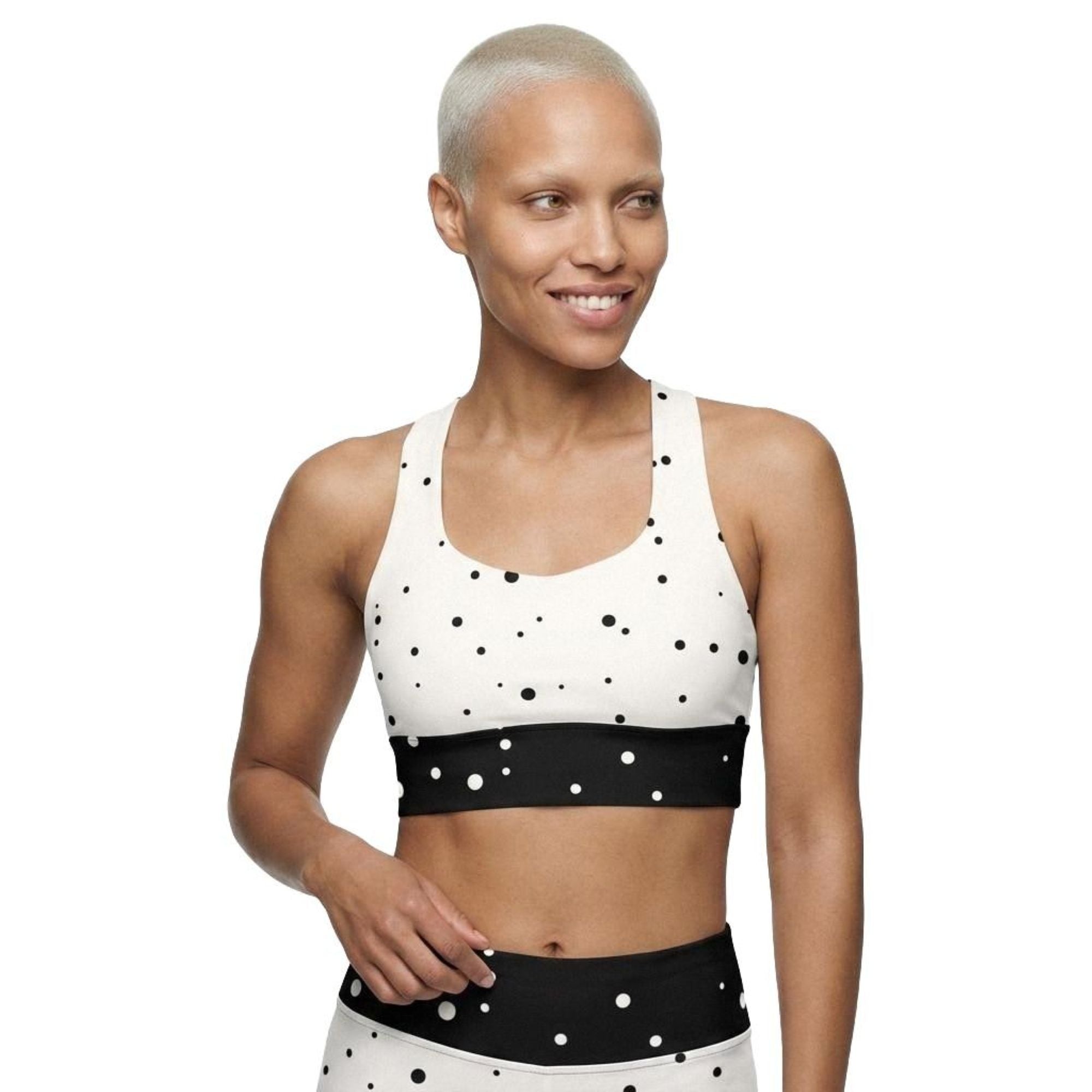 Model wearing God Approved longline sports bra front view with polka dot design