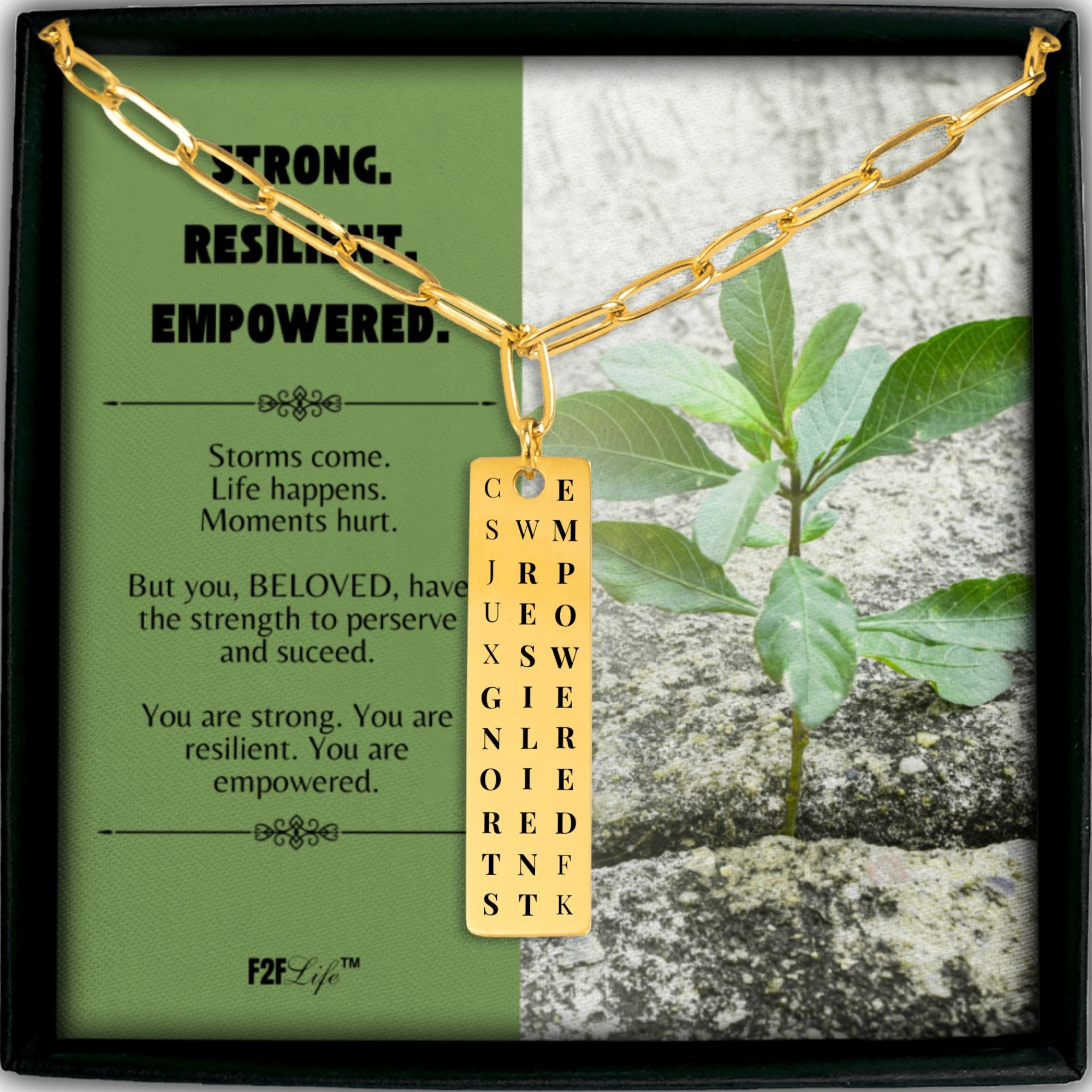 Gold plated strong resilient empowered vertical bar word search necklace with a paperclip chain in a box with a jewelry insert