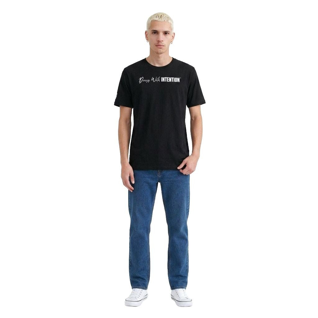 Model wearing Dear Human Behind Me Message 12 Shirt with Dress With Intention on Front in Black, Full Front