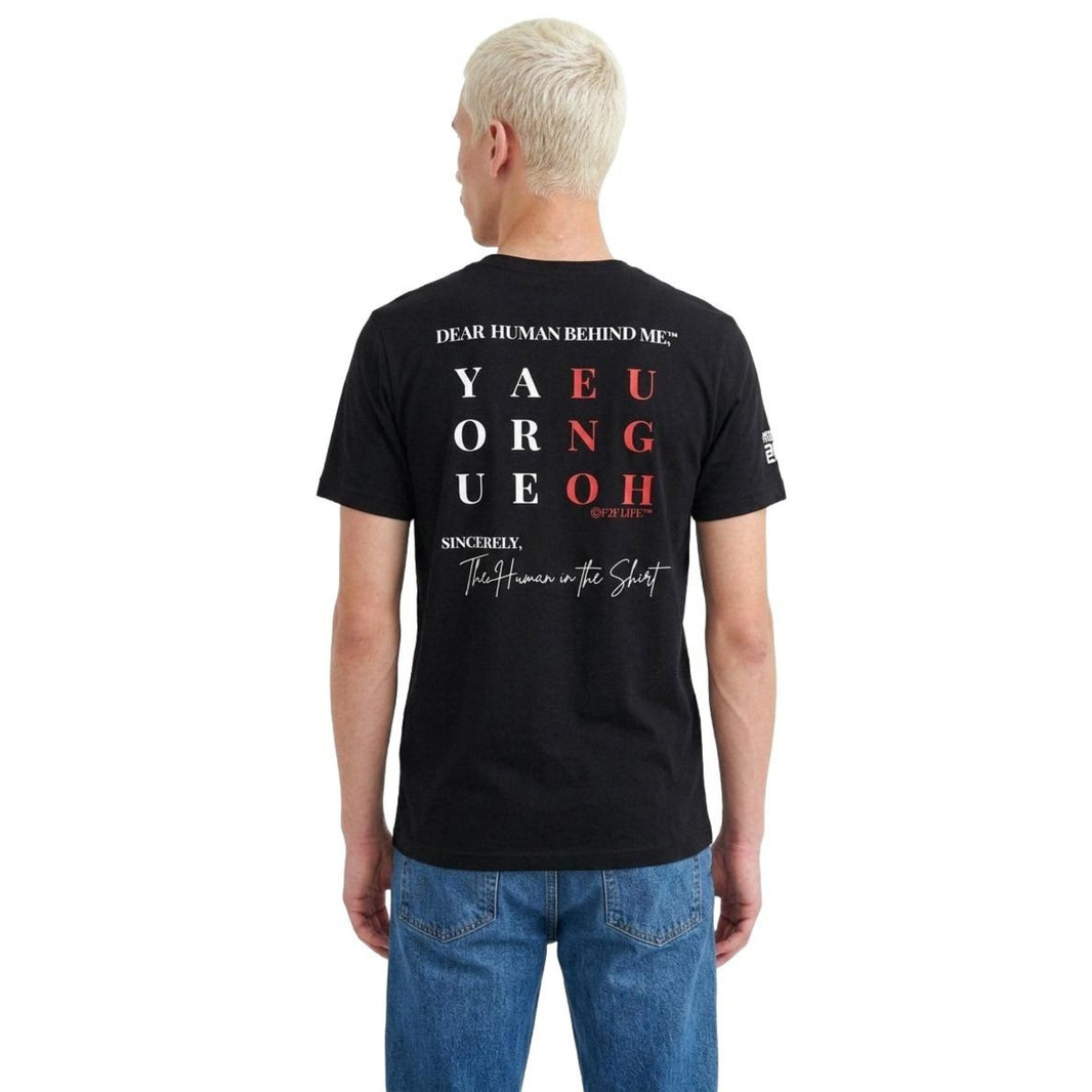 Model viewed from behind wearing Dear Human Behind Me, Message #2 You Are Enough T-shirt in black.