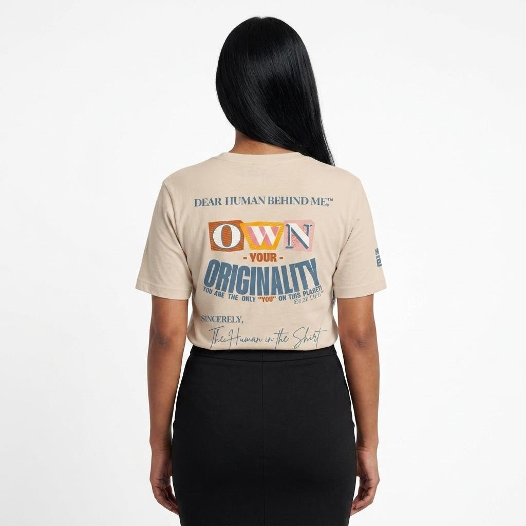Model viewed from behind wearing Dear Human Behind Me, Message #3 Own Your Originality T-shirt in natural.