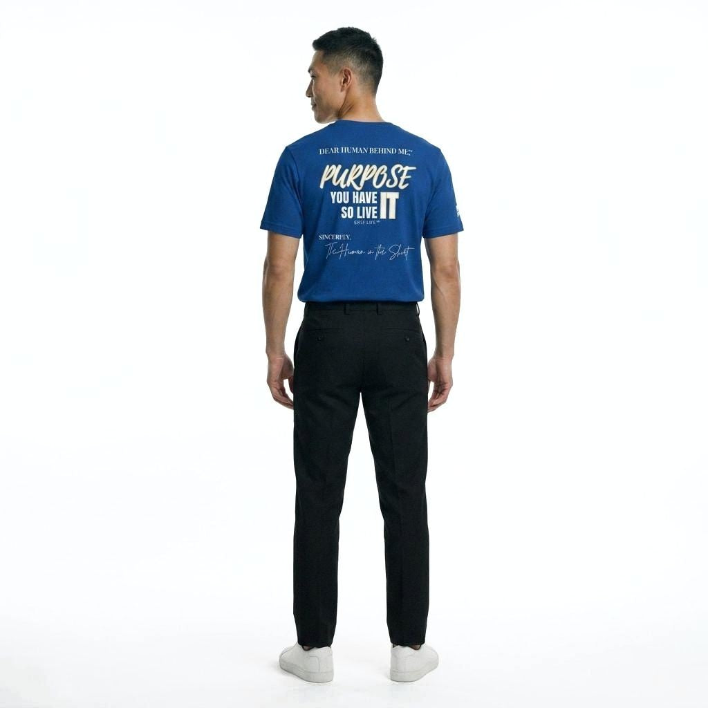 Model looking to side, viewed from behind wearing Dear Human Behind Me, Message #7 You Have Purpose T-shirt in blue.