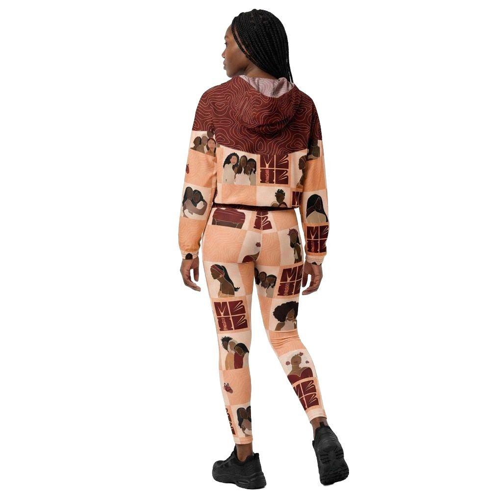 Model wearing My Black is Beautiful matching activewear set consisting of a cropped windbreaker and leggings, with black women pattern in red and creme, back view