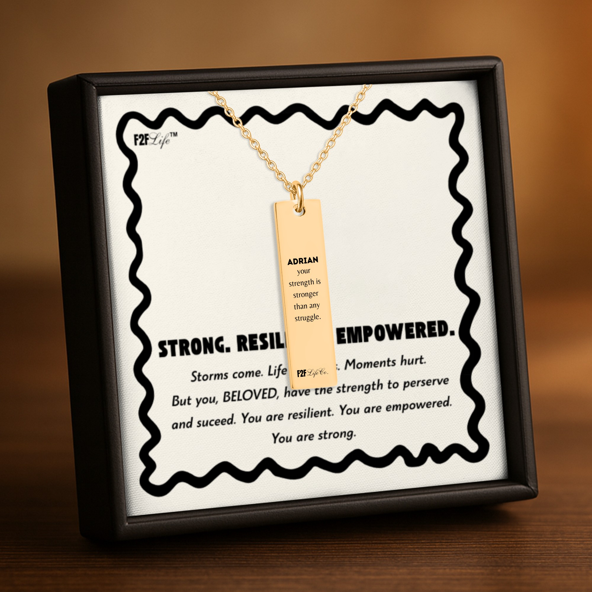 Resilient vertical bar necklace with fine chain back view, message and custom name in a jewelry box with insert