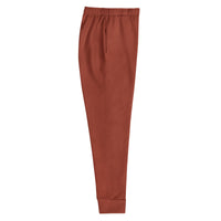 "Rooted Royalty" statement joggers with rust colorblock, women’s bold activewear right view