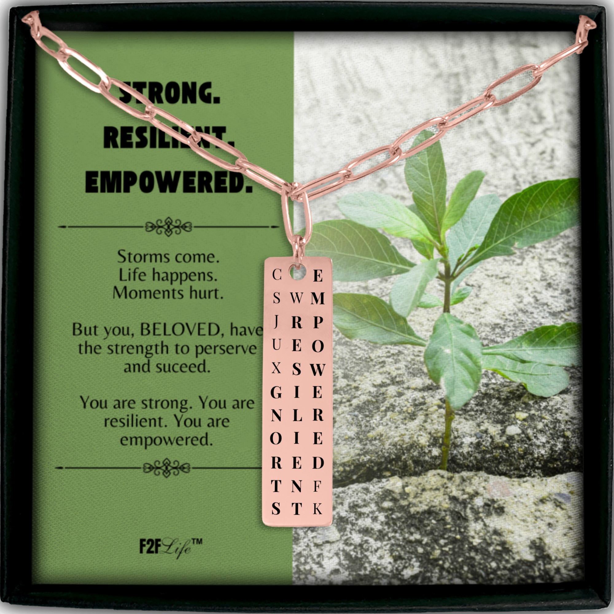 Rose gold plated strong resilient empowered vertical bar word search necklace with a paperclip chain in a box with a jewelry insert