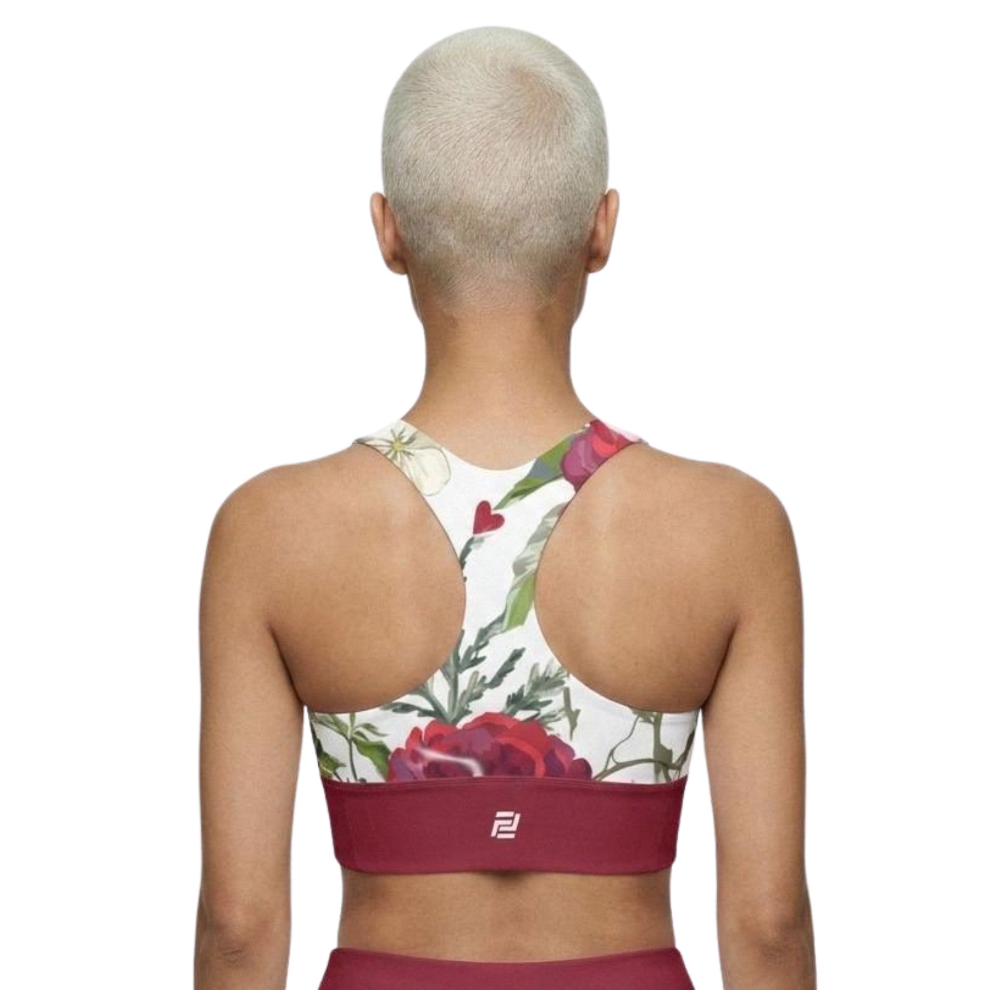 Model shown from the back wearing Roses of Grace sports bra  with a floral pattern and red band