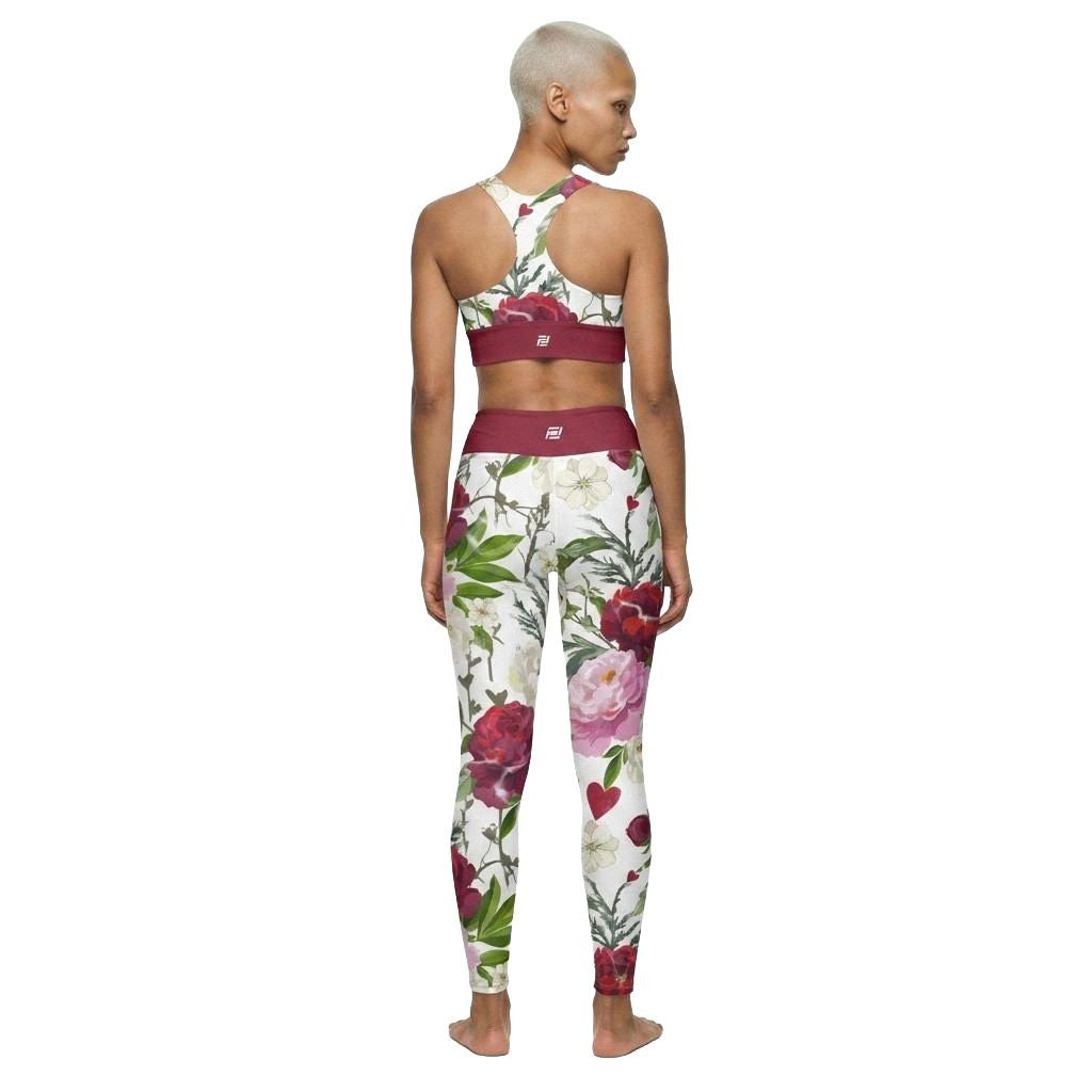 Model wearing roses of grace matching activewear set consisting of a sports bra and leggings, with floral pattern, back view