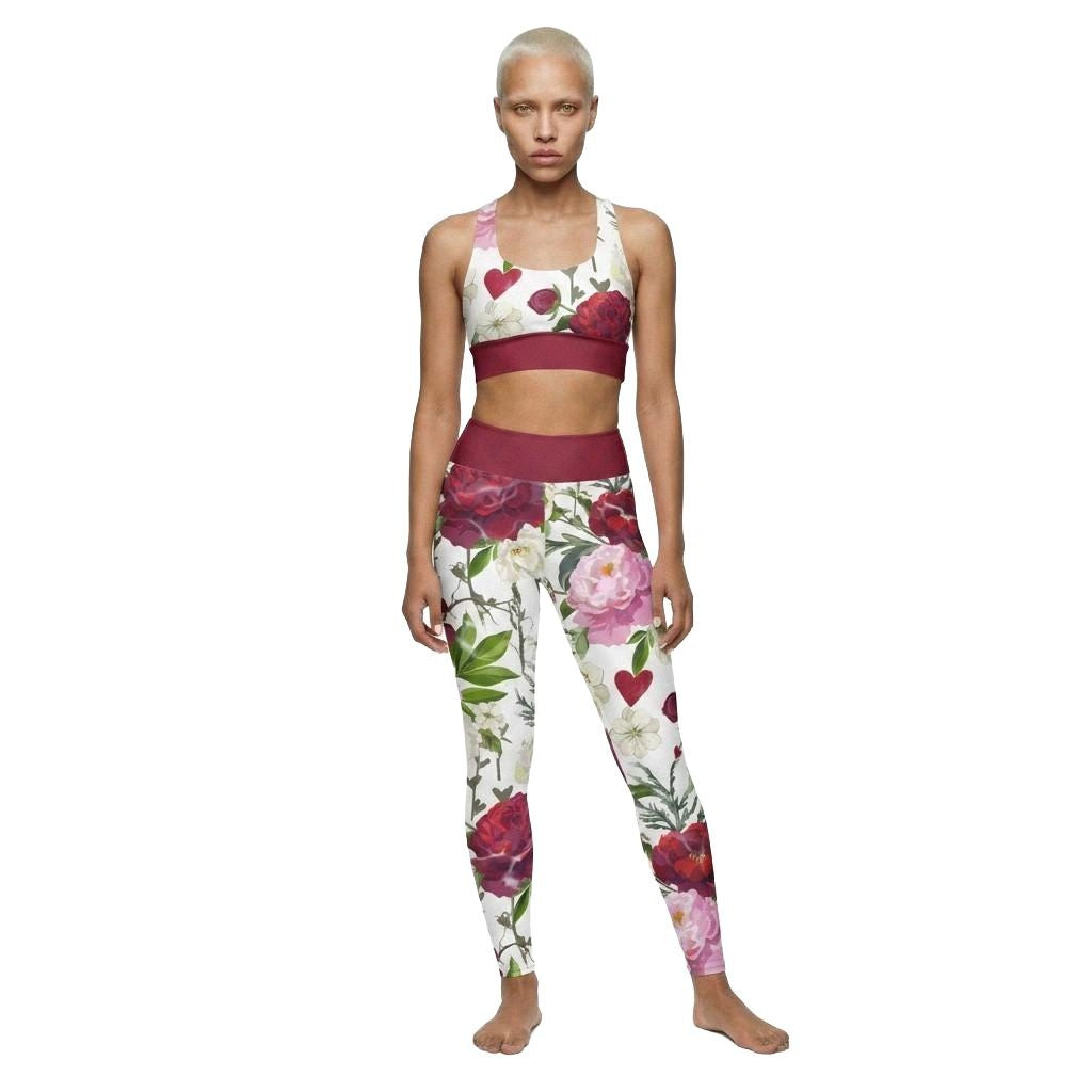 Model wearing roses of grace matching activewear set consisting of a sports bra and leggings, with floral pattern