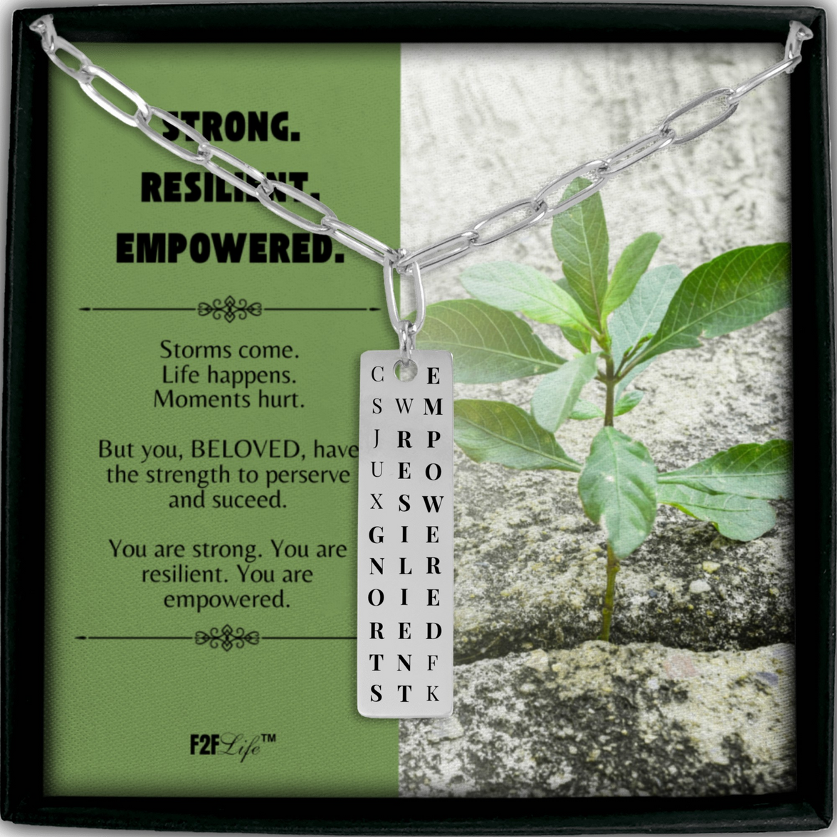 Stainless steel strong resilient empowered vertical bar word search necklace with a paperclip chain in a box with a jewelry insert