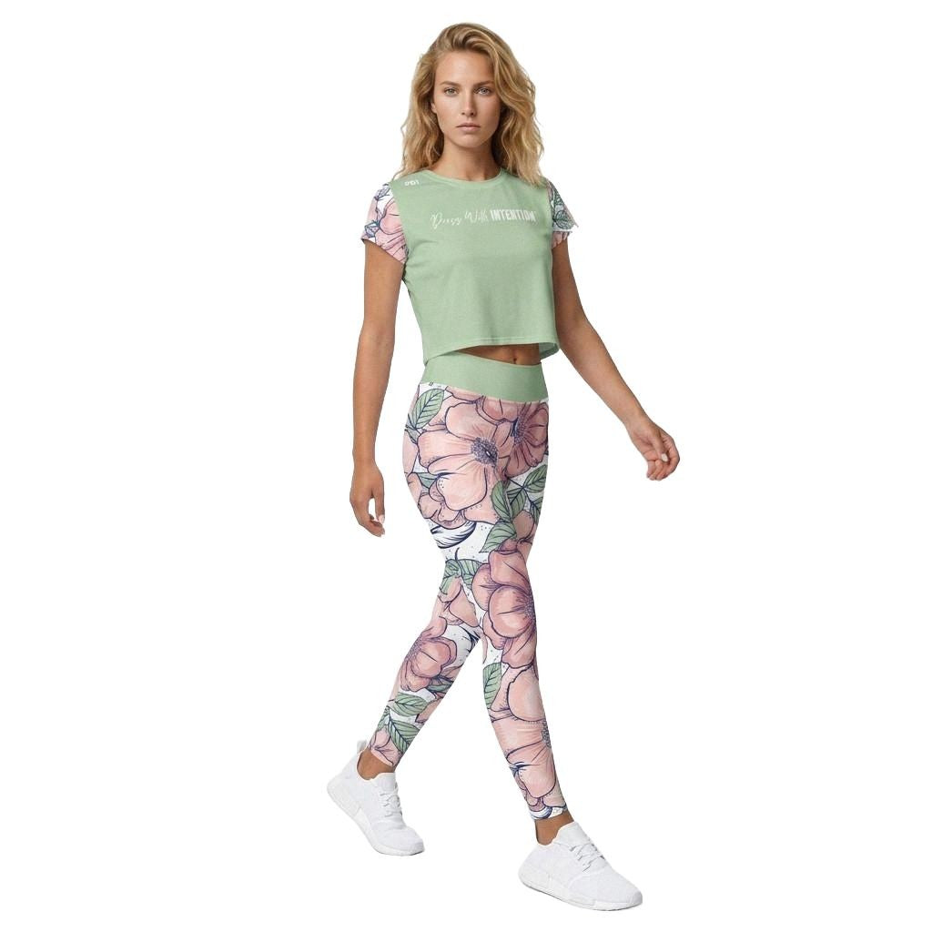 Model Wearing You Are Loved Crop Top with Dress With Intention on Front in green with matching workout leggings and floral design, front view