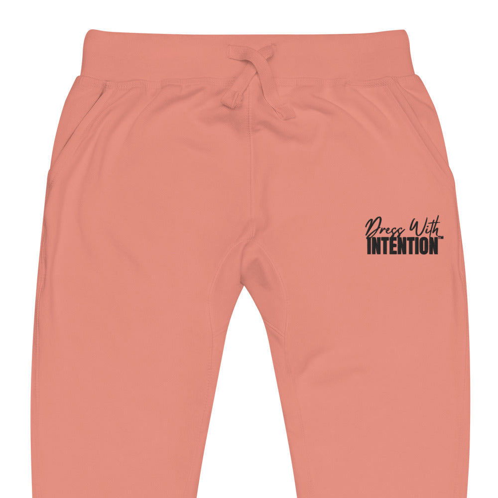 Zoomed in front view of "Dress With Intention" unisex joggers in dusty rose